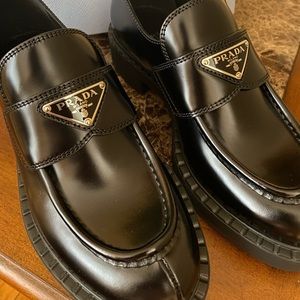 Prada
Leather Triangle Logo Loafers